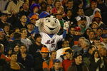 NEW YORK - OCTOBER 13:  Mr. Met of the New York Mets stands in the crowd during game two of the NLCS at Shea Stadium on October 13, 2006 in the Flushing neighborhood of the Queens borough of New York City.  (Photo by Al Bello/Getty Images)