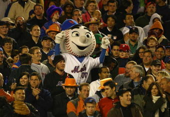 NEW YORK - OCTOBER 13:  Mr. Met of the New York Mets stands in the crowd during game two of the NLCS at Shea Stadium on October 13, 2006 in the Flushing neighborhood of the Queens borough of New York City.  (Photo by Al Bello/Getty Images)