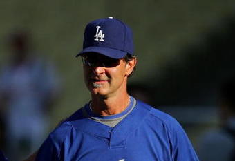 LOS ANGELES, CA - AUGUST 11: Hitting Coach Don Mattingly #8 of the Los Angeles Dodgers walks back to the dugout after batting practice prior to their MLB game against the Philadelphia Phillies at Dodger Stadium on August 11, 2008 in Los Angeles, California. The Dodgers defeated the Phillies 8-6.  (Photo by Victor Decolongon/Getty Images)
