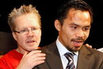 LAS VEGAS - DECEMBER 06:  Manny Pacquiao (R) of the Philippines and his trainer Freddie Roach appear at a news conference following Pacquiao's victory over Oscar De La Hoya in their welterweight bout at the MGM Grand Garden Arena December 6, 2008 in Las Vegas, Nevada.  (Photo by Ethan Miller/Getty Images)