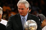 LOS ANGELES, CA - MAY 29:  (L-R) NBA legend Jerry West shakes hands with Los Angeles Lakers general manager Mitch Kupchak after defeating the Lakers defeated the San Antonio Spurs 100-92 in Game Five of the Western Conference Finals during the 2008 NBA Playoffs on May 29, 2008 at Staples Center in Los Angeles, California.  NOTE TO USER: User expressly acknowledges and agrees that, by downloading and/or using this Photograph, user is consenting to the terms and conditions of the Getty Images License Agreement.  (Photo by Jeff Gross/Getty Images)
