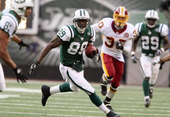 EAST RUTHERFORD, NJ - NOVEMBER 04: Jerricho Cotchery #89 of the New York Jets carries the ball against the Washington Redskins during their game on November 4, 2007 at Giants Stadium in East Rutherford, New Jersey. (Photo by Al Bello/Getty Images) 