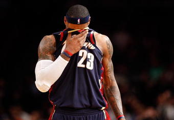 NEW YORK - FEBRUARY 04:  LeBron James #23 of the Cleveland Cavaliers wipes sweat from his face against the New York Knicks on February 4, 2009 at Madison Square Garden in New York City. NOTE TO USER: User expressly acknowledges and agrees that, by downloading and or using this photograph, User is consenting to the terms and conditions of the Getty Images License Agreement.  (Photo by Nick Laham/Getty Images)