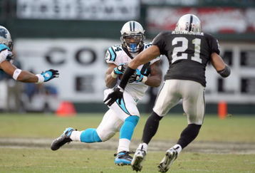 OAKLAND - NOVEMBER 9:  DeAngelo Williams #34 of the Carolina Panthers carries the ball against Nnamdi Asomugha #21 of the Oakland Raiders at the Oakland-Alameda County Coliseum on November 9, 2008 in Oakland, California. (Photo by: Jed Jacobsohn/Getty Images)