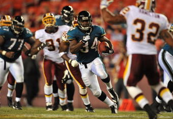 LANDOVER, MD - AUGUST 28: Running Back Chauncey Washington #34 of the Jacksonville Jaguars runs with the ball during the preseason game against the Washington Redskins on August 28, 2008 at FedEx Field in Landover, Maryland. The Jaguars won 24-3. (Photo by Larry French/Getty Images)