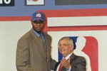 24 Jun 1998: A picture of the 1st Pick Michael Olowokandi by the Los Angeles Clippers shaking hands with David Stern the NBA Commissioner during the NBA Draft at the General Motors Palace in Vancouver, Canada. FOR EDITORIAL USE ONLY