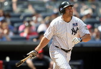 NEW YORK - JULY 04:  Johnny Damon #18 of the New York Yankees hits a  two run home run in the seventh against the Toronto Blue Jays on July 4, 2009 at Yankee Stadium in the Bronx borough of New York City.  (Photo by Nick Laham/Getty Images)