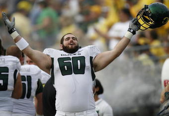 ANN ARBOR, MI - SEPTEMBER 08: Max Unger #60 of the Oregon Ducks celebrates on the sideline late in the fourth quarter against the Michigan Wolverines on September 8, 2007 at Michigan Stadium in Ann Arbor, Michigan. Oregon won the game 39-7.  (Photo By Gregory Shamus/Getty Images)