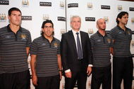 ABU DHABI, UNITED ARAB EMIRATES - JULY 16: Mark Hughes, Manchester City football club manager (C) poses with players Roque Santa Cruz (L), Carlos Tevez (2nd L), Steven Ireland (2nd R) and Gareth Barry after a Manchester City press conference at Emirates Palace on July 16, 2009 in Abu Dhabi, United Arab Emirates. (Photo by Jack Dabaghian /Getty Images for Etihad)
