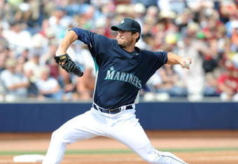 PEORIA, AZ - MARCH 08:   Ryan Rowland-Smith #18 of the Seattle Mariners pitches during a Spring Training game against the Arizona Diamondbacks at Peoria Stadium on March 8, 2009 in Peoria, Arizona.  (Photo by Lisa Blumenfeld/Getty Images)