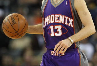 OAKLAND, CA - MARCH 15:  Steve Nash #13 of the Phoenix Suns dribbles the ball against the Golden State Warriors during an NBA game on March 15, 2009 at Oracle Arena in Oakland, California. NOTE TO USER: User expressly acknowledges and agrees that, by downloading and or using this photograph, User is consenting to the terms and conditions of the Getty Images License Agreement.  (Photo by Jed Jacobsohn/Getty Images)