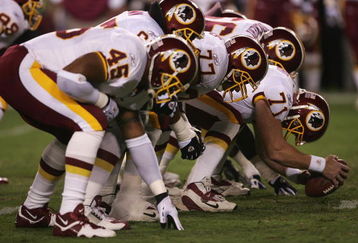 LANDOVER, MD - SEPTEMBER 27:  The Washington Redskins offensive line sets for the snap of the ball during the fourth quarter of their game against the Dallas Cowboys in the third week of the NFL season at FedEx Field September 27, 2004 in Landover, Maryland.  (Photo by Doug Pensinger/Getty Images)