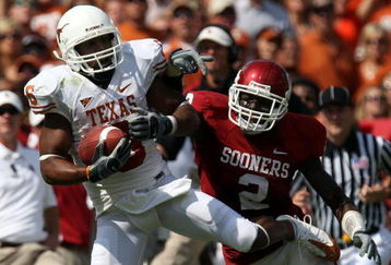 DALLAS - OCTOBER 11:  Wide receiver Quan Cosby #6 the Texas Longhorns makes a pass reception against Brian Jackson #2 of the Oklahoma Sooners during the Red River Rivalry at the Cotton Bowl on October 11, 2008 in Dallas, Texas.  (Photo by Ronald Martinez/Getty Images)