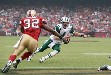 SAN FRANCISCO - DECEMBER 07:  Quarterback Brett Favre #4 of the New York Jets runs for the touchdown against Michael Lewis #32 of the San Francisco 49ers during an NFL game on December 7, 2008 at Candlestick Park in San Francisco, California. (Photo by Jed Jacobsohn/Getty Images)