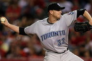 ANAHEIM, CA - MAY 6:  Roy Halladay #32 of the Toronto Blue Jays throws a pitch against the Los Angeles Angels of Anaheim at Angel Stadium May 6, 2009 in Anaheim, California.  (Photo by Stephen Dunn/Getty Images)
