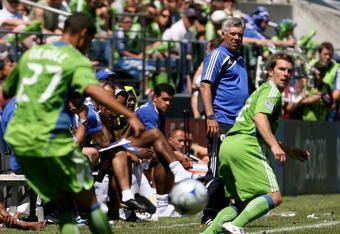 SEATTLE - JULY 18:  Manager Carlo Ancelotti of Chelsea FC looks on as Lamar Neagle #27 of Seattle Sounders FC passes to Michael Fucito #2 during the friendly match on July 18, 2009 at Qwest Field in Seattle, Washington. Chelsea FC defeated Seattle 2-0. (Photo by Otto Greule Jr/Getty Images)