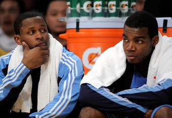 LOS ANGELES, CA - APRIL 27:  (L-R) C.J. Miles #34 and Paul Millsap #24 of the Utah Jazz sit on the bench in the second quarter against the Los Angeles Lakers in Game Five of the Western Conference Quarterfinals during the 2009 NBA Playoffs at Staples Center on April 27, 2009 in Los Angeles, California. NOTE TO USER: User expressly acknowledges and agrees that, by downloading and or using this photograph, User is consenting to the terms and conditions of the Getty Images License Agreement.  (Photo by Kevork Djansezian/Getty Images)