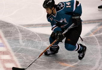 SAN JOSE, CA - APRIL 25:  Jonathan Cheechoo #14 of the San Jose Sharks controls the puck against the Anaheim Ducks during Game Five of the Western Conference Quarterfinal Round of the 2009 NHL Stanley Cup Playoffs at HP Pavilion on April 25, 2009 in San Jose, California. The Sharks won 3-2 in overtime.  (Photo by Stephen Dunn/Getty Images)