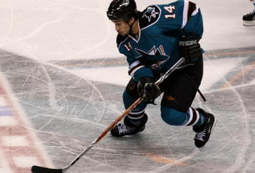 SAN JOSE, CA - APRIL 25:  Jonathan Cheechoo #14 of the San Jose Sharks controls the puck against the Anaheim Ducks during Game Five of the Western Conference Quarterfinal Round of the 2009 NHL Stanley Cup Playoffs at HP Pavilion on April 25, 2009 in San Jose, California. The Sharks won 3-2 in overtime.  (Photo by Stephen Dunn/Getty Images)