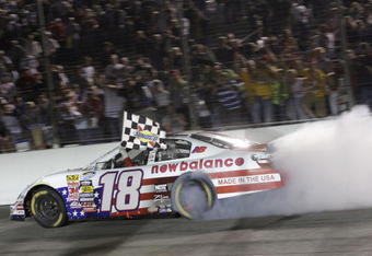 MADISON, IL - JULY 18:  Kyle Busch, driver of the #18 New Balance Toyota, performs a burnout after winning the NASCAR Nationwide Series Missouri-Illinois Dodge Dealers 250 at Gateway International Raceway on July 18, 2009 in Madison, Illinois.  (Photo by Jamie Squire/Getty Images)