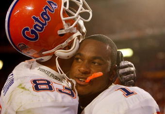 MIAMI - JANUARY 08:  David Nelson #83 and Percy Harvin #1 celebrate with after defeating the Oklahoma Sooners in the FedEx BCS National Championship Game at Dolphin Stadium on January 8, 2009 in Miami, Florida. The Gators won the game by a score of 24-14.  (Photo by Eliot J. Schechter/Getty Images)