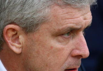 PORTSMOUTH, UNITED KINGDOM - FEBRUARY 14:  Mark Hughes the Manchester City manager looks on during the Barclays Premier League match between Portsmouth and Manchester City at Fratton Park on February 14, 2009 in London, England.  (Photo by Phil Cole/Getty Images)