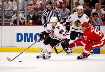 DETROIT - MAY 27:  Patrick Kane #88 of the Chicago Blackhawks skates with the puck against Valtteri Filppula #51 of the Detroit Red Wings during Game Five of the Western Conference Championship Round of the 2009 Stanley Cup Playoffs on May 27, 2009 at Joe Louis Arena in Detroit, Michigan.  (Photo by Gregory Shamus/Getty Images)