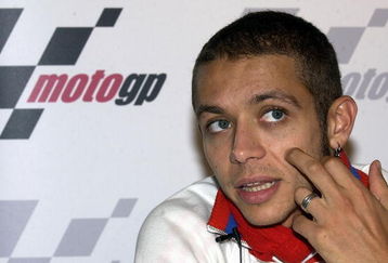 LONDON - JULY 8:  Valentino Rossi of Italy, World Moto GP Champion, takes questions from the media during a press conference aboard the 'Elizabethan' July 8, 2003 on the River Thames in London. Rossi will compete in the British round of the World Moto GP Championship July 13, 2003 at Donington Park.  (Photo by Dan Regan/Getty Images)