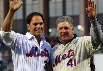 NEW YORK - APRIL 13:  Former Mets players Mike Piazza and Tom Seaver greet fans before throwing out the first pitch of the San Diego Padres against the New York Mets during opening day at Citi Field on April 13, 2009 in the Flushing neighborhood of the Queens borough of New York City. This is the first regular season MLB game being played at the new venue which replaced Shea stadium as the Mets home field.  (Photo by Jim McIsaac/Getty Images)