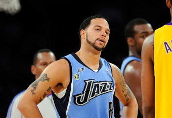 LOS ANGELES, CA - APRIL 27:  Deron Williams #8 of the Utah Jazz looks over at Trevor Ariza #3 of the Los Angeles Lakers in the second half of Game Five of the Western Conference Quarterfinals during the 2009 NBA Playoffs at Staples Center on April 27, 2009 in Los Angeles, California. NOTE TO USER: User expressly acknowledges and agrees that, by downloading and or using this photograph, User is consenting to the terms and conditions of the Getty Images License Agreement.  (Photo by Kevork Djansezian/Getty Images)