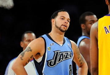 LOS ANGELES, CA - APRIL 27:  Deron Williams #8 of the Utah Jazz looks over at Trevor Ariza #3 of the Los Angeles Lakers in the second half of Game Five of the Western Conference Quarterfinals during the 2009 NBA Playoffs at Staples Center on April 27, 2009 in Los Angeles, California. NOTE TO USER: User expressly acknowledges and agrees that, by downloading and or using this photograph, User is consenting to the terms and conditions of the Getty Images License Agreement.  (Photo by Kevork Djansezian/Getty Images)