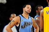 LOS ANGELES, CA - APRIL 27:  Deron Williams #8 of the Utah Jazz looks over at Trevor Ariza #3 of the Los Angeles Lakers in the second half of Game Five of the Western Conference Quarterfinals during the 2009 NBA Playoffs at Staples Center on April 27, 2009 in Los Angeles, California. NOTE TO USER: User expressly acknowledges and agrees that, by downloading and or using this photograph, User is consenting to the terms and conditions of the Getty Images License Agreement.  (Photo by Kevork Djansezian/Getty Images)
