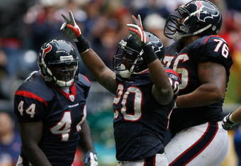 HOUSTON - DECEMBER 28:  Steve Slaton #20 of the the Houston Texans celebrates his touchdown for a 31-17 lead with teammates Duane Brown #76 and Vonta Leach #44 against the Chicago Bears during the second half at the Reliant Stadium December 28, 2008 in Houston, Texas.  The Texans won 31-24.  (Photo by Harry How/Getty Images)
