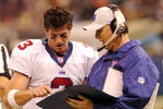 NEW ORLEANS - DECEMBER 14:  Jesse Palmer #3 of the New York Giants speaks with quarterback coach Turk Schonert during the 4th quarter against the New Orleans Saints on December 14, 2003 at the Superdome in New Orleans, Louisiana. The Saints defeated the Giants 45-7.  (Photo by Chris Graythen/Getty Images)