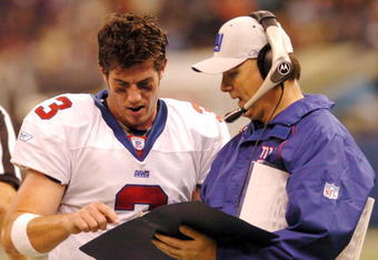 NEW ORLEANS - DECEMBER 14:  Jesse Palmer #3 of the New York Giants speaks with quarterback coach Turk Schonert during the 4th quarter against the New Orleans Saints on December 14, 2003 at the Superdome in New Orleans, Louisiana. The Saints defeated the Giants 45-7.  (Photo by Chris Graythen/Getty Images)