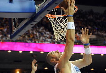 ORLANDO, FL - JUNE 14:  Marcin Gortat #13 of the Orlando Magic goes up for a shot against Jordan Farmar #5 of the Los Angeles Lakers  in the second half of Game Five of the 2009 NBA Finals on June 14, 2009 at Amway Arena in Orlando, Florida.  NOTE TO USER:  User expressly acknowledges and agrees that, by downloading and or using this photograph, User is consenting to the terms and conditions of the Getty Images License Agreement.  (Photo by Ronald Martinez/Getty Images)