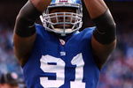 EAST RUTHERFORD, NJ - JANUARY 11:  Justin Tuck #91 of the New York Giants reacts after a saftey against the Philadelphia Eagles during the NFC Divisional Playoff Game on January 11, 2009 at Giants Stadium in East Rutherford, New Jersey.  (Photo by Al Bello/Getty Images)