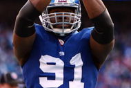 EAST RUTHERFORD, NJ - JANUARY 11:  Justin Tuck #91 of the New York Giants reacts after a saftey against the Philadelphia Eagles during the NFC Divisional Playoff Game on January 11, 2009 at Giants Stadium in East Rutherford, New Jersey.  (Photo by Al Bello/Getty Images)