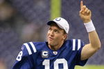 INDIANAPOLIS - DECEMBER 07:  Peyton Manning #18 of the Indianapolis Colts celebrates as he runs off the field after their 35-3 win against the Cincinnati Bengals at Lucas Oil Stadium on December 7, 2008 in Indianapolis, Indiana.  (Photo by Andy Lyons/Getty Images)