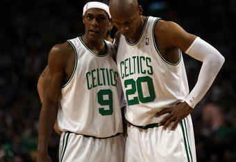 BOSTON - MAY 17:  Rajon Rondo #9 and Ray Allen #20 of the Boston Celtics talk as the Orlando Magic shoot a free throw in Game Seven of the Eastern Conference Semifinals during the 2009 NBA Playoffs at TD Banknorth Garden on May 17, 2009 in Boston, Massachusetts. The Orlando Magic defeated the Boston Celtics 101-82 to advance to the Eastern Conference Finals. NOTE TO USER: User expressly acknowledges and agrees that, by downloading and or using this photograph, User is consenting to the terms and conditions of the Getty Images License Agreement.  (Photo by Elsa/Getty Images)