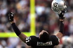 WASHINGTON - NOVEMBER 20:  Oakland Raiders cornerback Nnamdi Asomugha #21 celebrates after the Raiders recovered a game winning fumble in the fourth quarter on November 20, 2005 at Fed Ex Field in Landover, Maryland.  (Photo by Win McNamee/Getty Images)