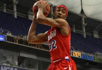 MINNEAPOLIS - MARCH 22:  Marcus Johnson #32 of the Dayton Flyers grabs a defensive rebound in the first half against the Kansas Jayhawks during the second round of the NCAA Division I Men's Basketball Tournament at the Hubert H. Humphrey Metrodome on March 22, 2009 in Minneapolis, Minnesota.  (Photo by Jonathan Daniel/Getty Images)