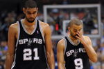 DALLAS - APRIL 25:  Forward Tim Duncan #21 and Tony Parker #9 of the San Antonio Spurs during a 99-90 loss against the Dallas Mavericks in Game Four of the Western Conference Quarterfinals during the 2009 NBA Playoffs at American Airlines Center on April 25, 2009 in Dallas, Texas. NOTE TO USER: User expressly acknowledges and agrees that, by downloading and or using this photograph, User is consenting to the terms and conditions of the Getty Images License Agreement.  (Photo by Ronald Martinez/Getty Images)
