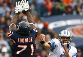 CHICAGO - NOVEMBER 02:  Lineman Israel Idonije #71 of the Chicago Bears blocks a pass from quarterback Dan Orlovsky #6 of the Detroit Lions during the fourth quarter at Soldier Field on November 2, 2008 in Chicago, Illinois. The Bears defeated the Lions 27-23.  (Photo by Jeff Gross/Getty Images)