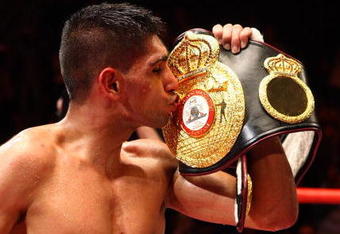 MANCHESTER, ENGLAND - JULY 18:  Amir Khan celebrates after defeating Andreas Kotelnik to become the WBA Light Welterweight Champion on July 18, 2009 at the MEN Arena in Manchester, England.  (Photo by John Gichigi/Getty Images)
