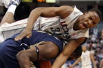 HARTFORD, CT - FEBRUARY 16:  Hasheem Thabeet #34 of the Connecticut Huskies and DeJuan Blair #45 of the Pittsburgh Panthers fight for the rebound on February 16, 2009 at XL Center  in Hartford, Connecticut. Thabeet was thrown to the ground on the play.  (Photo by Elsa/Getty Images)