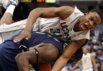 HARTFORD, CT - FEBRUARY 16:  Hasheem Thabeet #34 of the Connecticut Huskies and DeJuan Blair #45 of the Pittsburgh Panthers fight for the rebound on February 16, 2009 at XL Center  in Hartford, Connecticut. Thabeet was thrown to the ground on the play.  (Photo by Elsa/Getty Images)