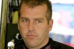 DARLINGTON, SC - MAY 08: Jeremy Mayfield, driver of the #41 SmallSponsor.com Toyota, stands in the garage during practice for the NASCAR Sprint Cup Series Southern 500 on May 8, 2009 at Darlington Raceway in Darlington, South Carolina.  (Photo by Jerry Markland/Getty Images for NASCAR)