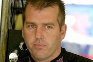 DARLINGTON, SC - MAY 08: Jeremy Mayfield, driver of the #41 SmallSponsor.com Toyota, stands in the garage during practice for the NASCAR Sprint Cup Series Southern 500 on May 8, 2009 at Darlington Raceway in Darlington, South Carolina.  (Photo by Jerry Markland/Getty Images for NASCAR)