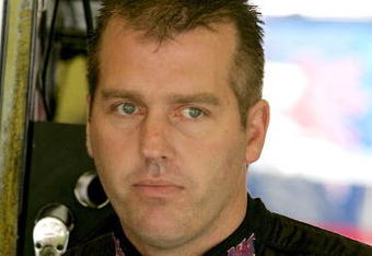 DARLINGTON, SC - MAY 08: Jeremy Mayfield, driver of the #41 SmallSponsor.com Toyota, stands in the garage during practice for the NASCAR Sprint Cup Series Southern 500 on May 8, 2009 at Darlington Raceway in Darlington, South Carolina.  (Photo by Jerry Markland/Getty Images for NASCAR)